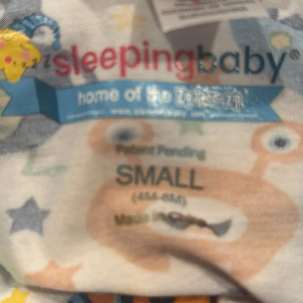 Sleeping baby Zipadee-zip mister boys sleep sack size 4-8 months.